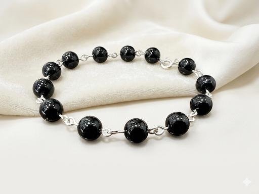 Pulsera con esferas de obsidiana negra y plata ley 950